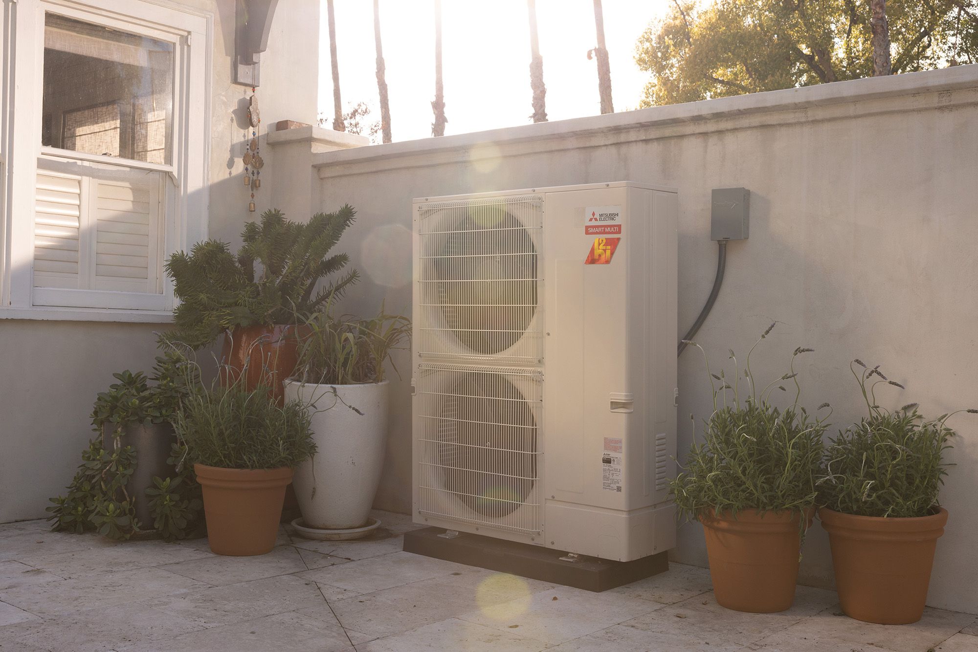 Outdoor heat pump installed in back of home