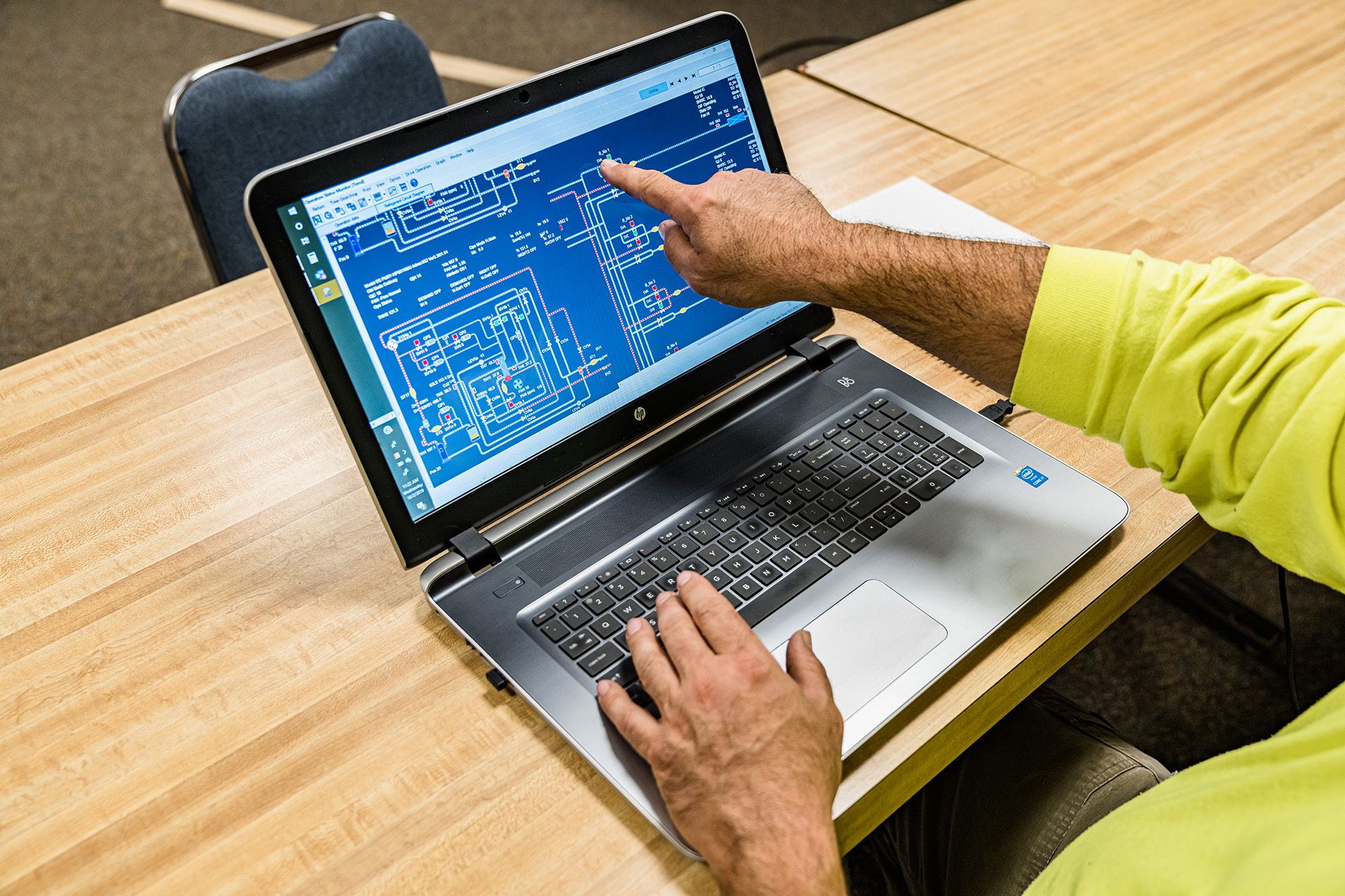 man using laptop to control mitsubishi electric commercial HVAC equipment