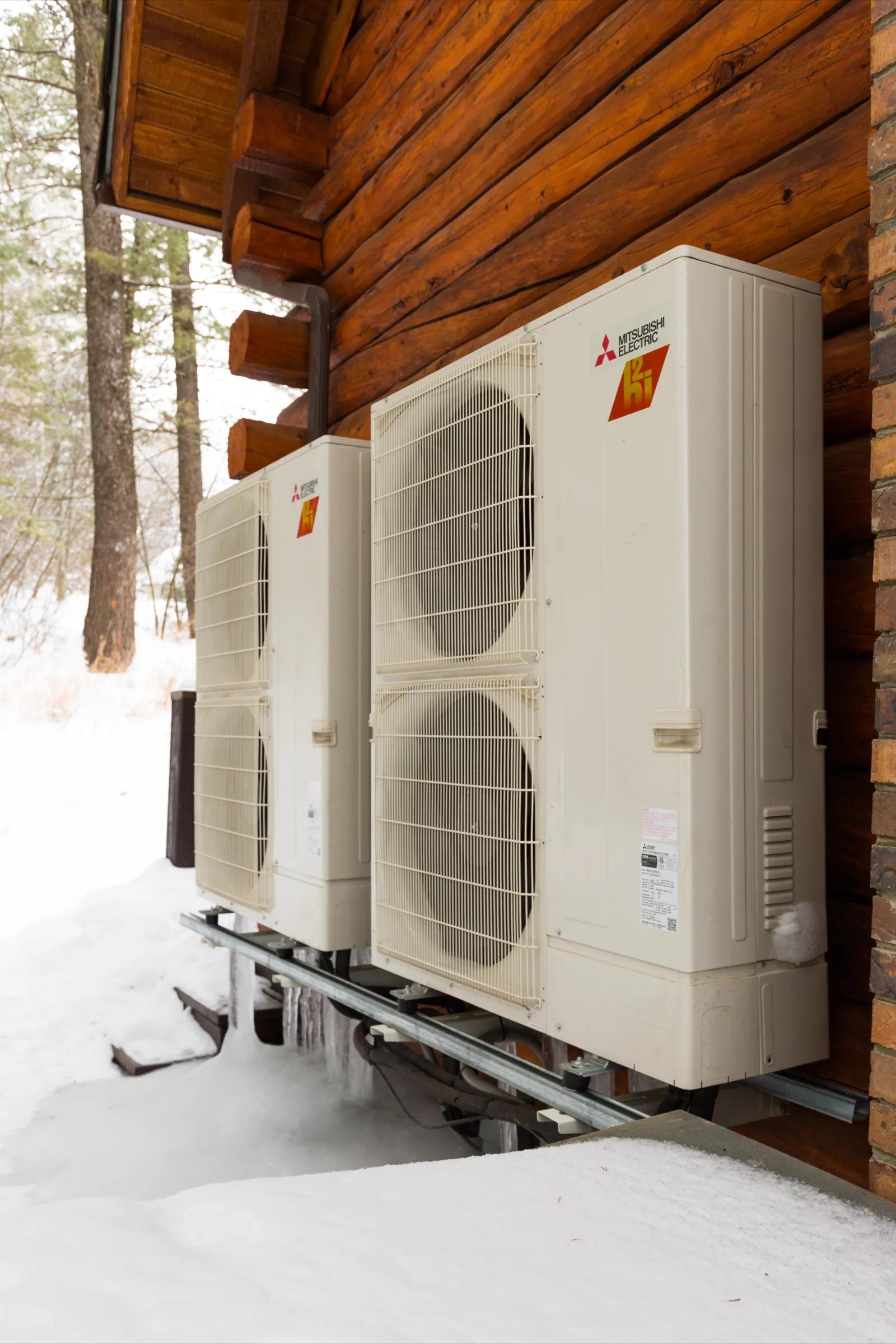 two multi zone heat pump outdoor log cabin snow
