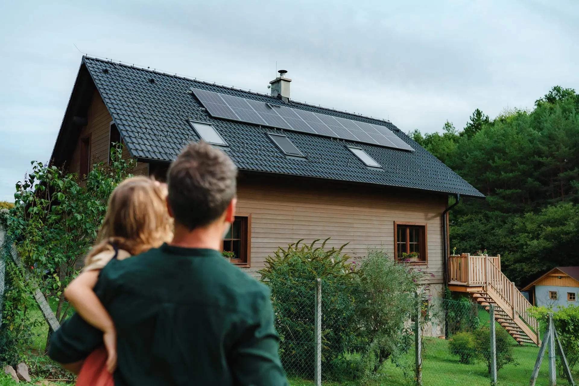 7 Ways to Dial Down Your Energy Bills During Record-High Summer Heat house home family solar energy roof outdoors summer architecture nature wood electricity alternative solar building people window grass sky technology