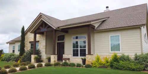 Project Profile: the Custom-Built Schulenburg Homehome house architecture family luxury suburb driveway real porch realty window lawn yard mortgage property outdoors spacious building roof