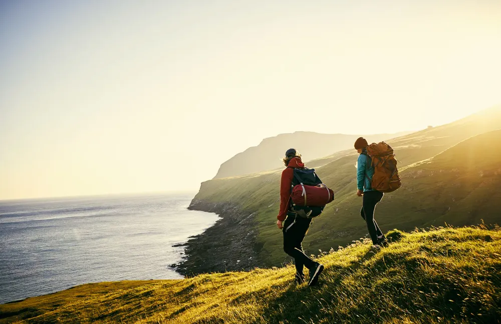 Couple hiking through coastal scenery