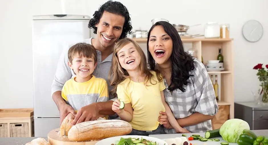 Total Home Comfort: the Little Luxury You'Ll Notice Every Day family togetherness cooking child fun indoors woman knife laughing lifestyle cute enjoyment salad love lunch casual preparation man happiness meal