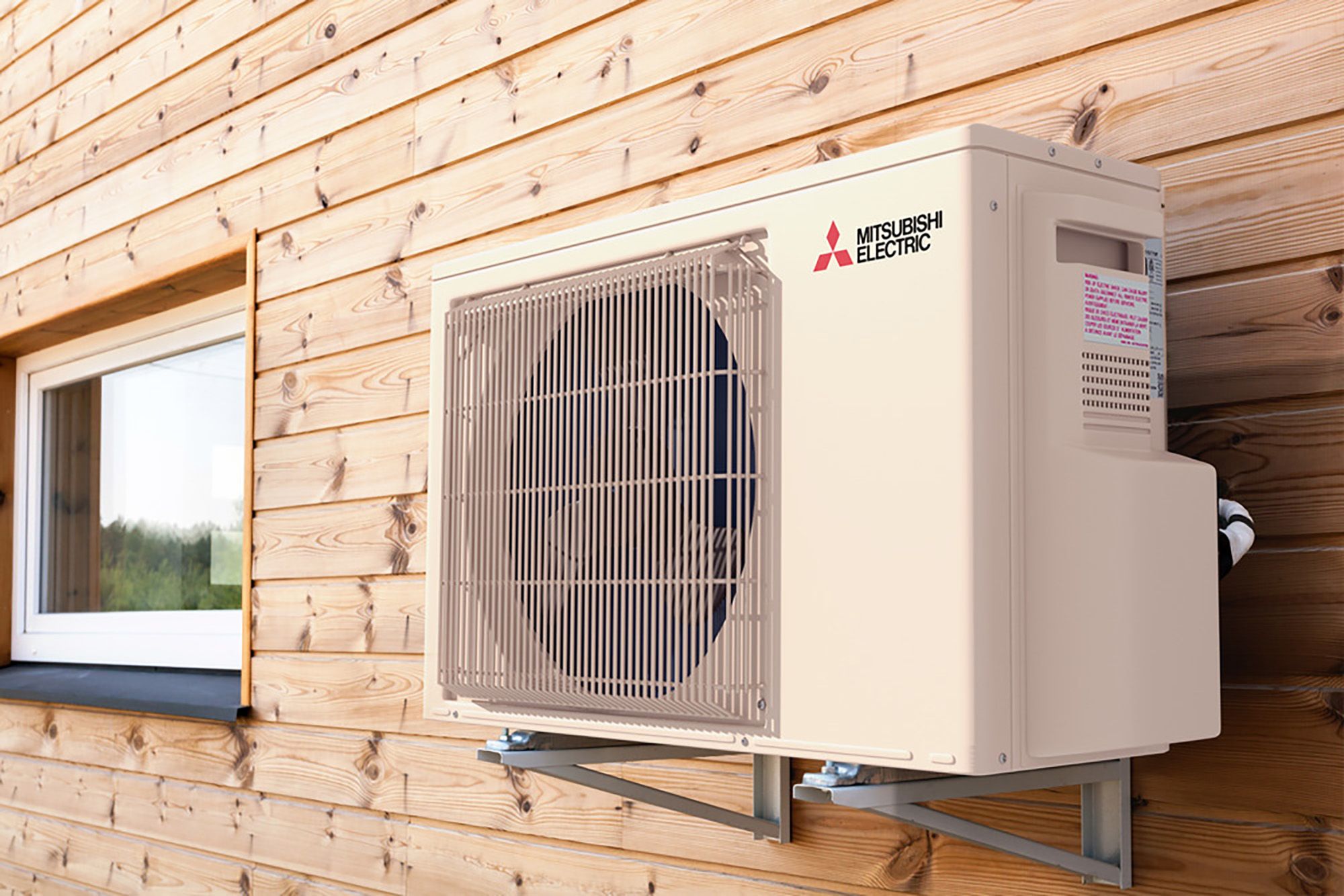 SUZ-NL Single zone universal heat pump outside wall of wood cabin