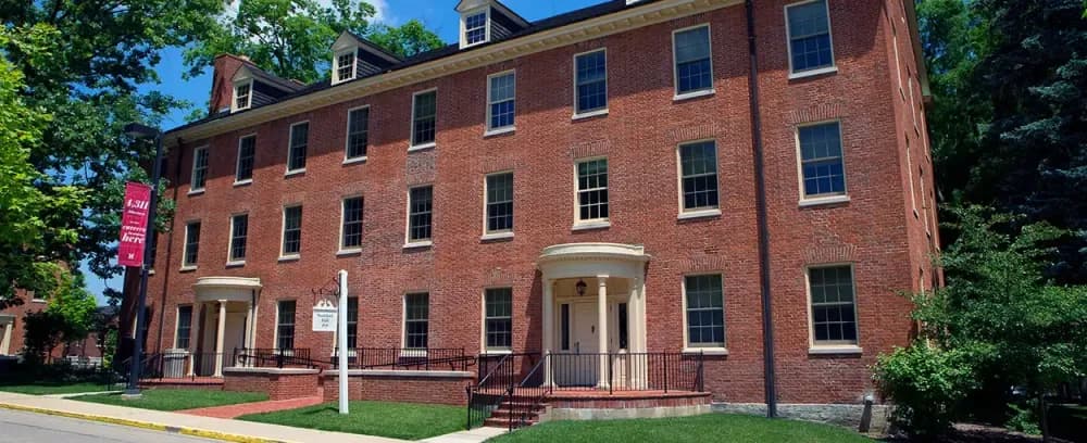 Miami University's Elliot Hall and Stoddard Hall home architecture house building family brick window yard facade estate street residential lawn mortgage roof construction exterior class mansion door