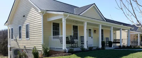 The Inn at Willow Grove home porch house architecture family yard suburb suburban realty window mortgage driveway luxury upscale property real building door entrance