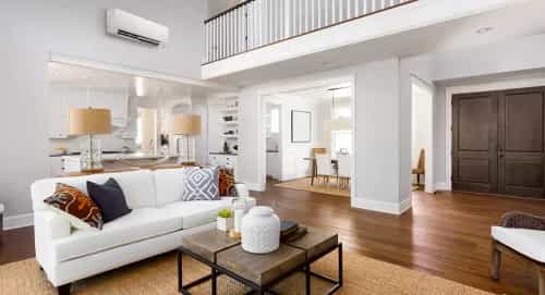 What to Know About Building High-Performance Homes contemporary indoors luxury sofa family room spacious apartment parquet minimalist seat comfort home coffee table chair table